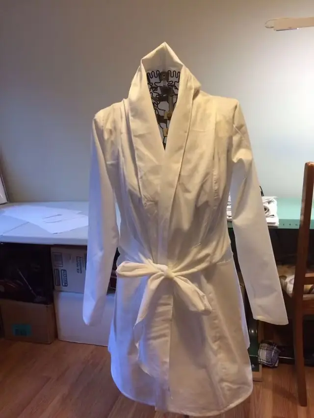 Nina's Tailoring workroom, a robe finished on a dress form